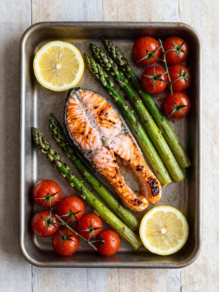 Sheet pan salmon with asparagus, cherry tomatoes and lemon